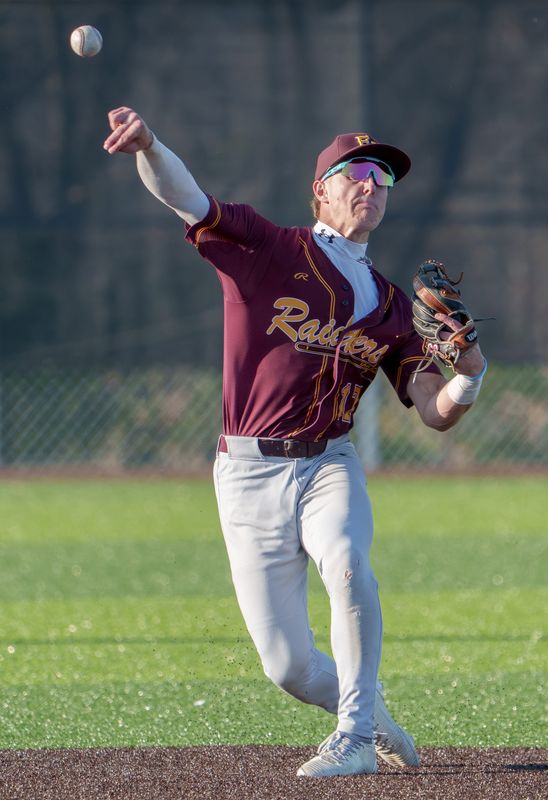 East Peoria’s Jackson Ahrens throws to first base for an out against Limestone during their high school baseball game Wednesday, April 8, 2026 at EastSide Centre in East Peoria. The Raiders routed the Rockets 12-2 in six innings.