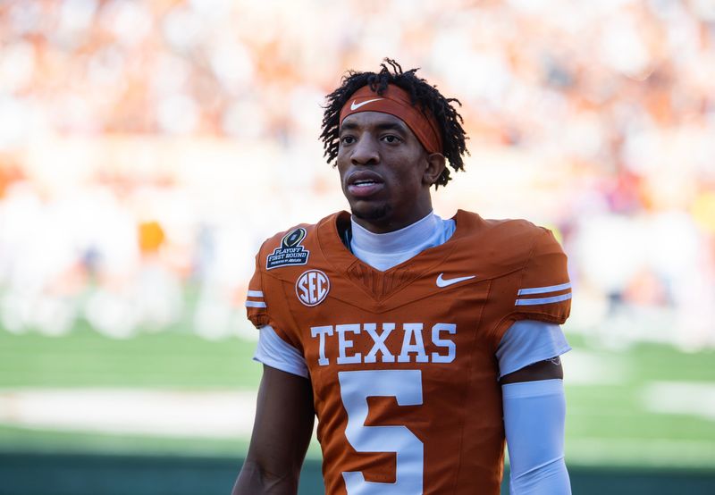 Dec 21, 2024; Austin, Texas, USA; Texas Longhorns defensive back Malik Muhammad (5) against the Clemson Tigers during the CFP National playoff first round at Darrell K Royal-Texas Memorial Stadium. Mandatory Credit: Mark J. Rebilas-Imagn Images