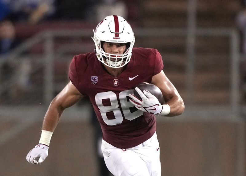 Oct 21, 2023; Stanford, California, USA; Stanford Cardinal tight end Sam Roush (86) runs after a catch against UCLA Bruins linebacker Oluwafemi Oladejo (2) during the third quarter at Stanford Stadium. Mandatory Credit: Darren Yamashita-USA TODAY Sports