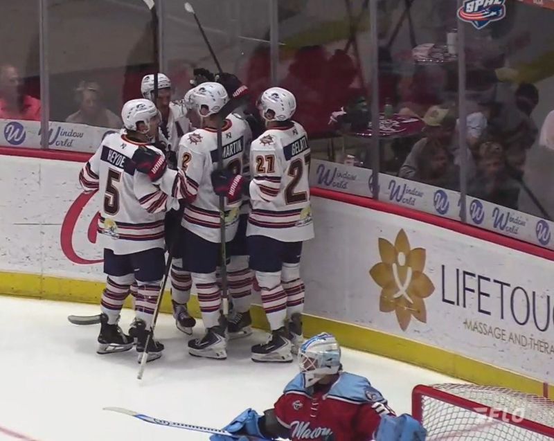 The Peoria Rivermen celebrate a goal by center Garrett Devine against Macon goaltender Josh Boyko during Peoria's 2-0 victory in Game 1 of the SPHL first-round playoff series at Macon Coliseum on April 9, 2026.