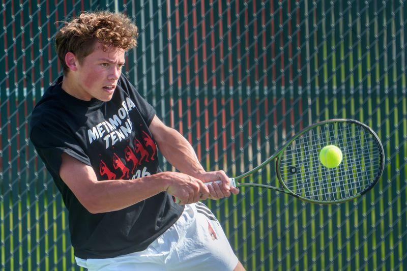Metamora’s Dane Hutchison makes a return against Pekin’s Cayden Hopper in a Mid-Illini dual tennis match Tuesday, April 14, 2026 in Metamora.