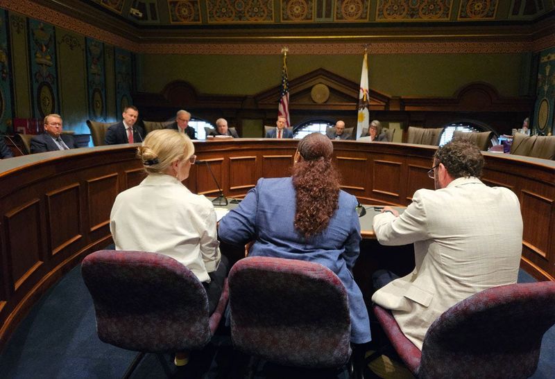 Officials from the Department of Central Management Services testify before the legislative Commission on Government Forecasting and Accountability about expected cost increases next year in the state employee group health insurance system.