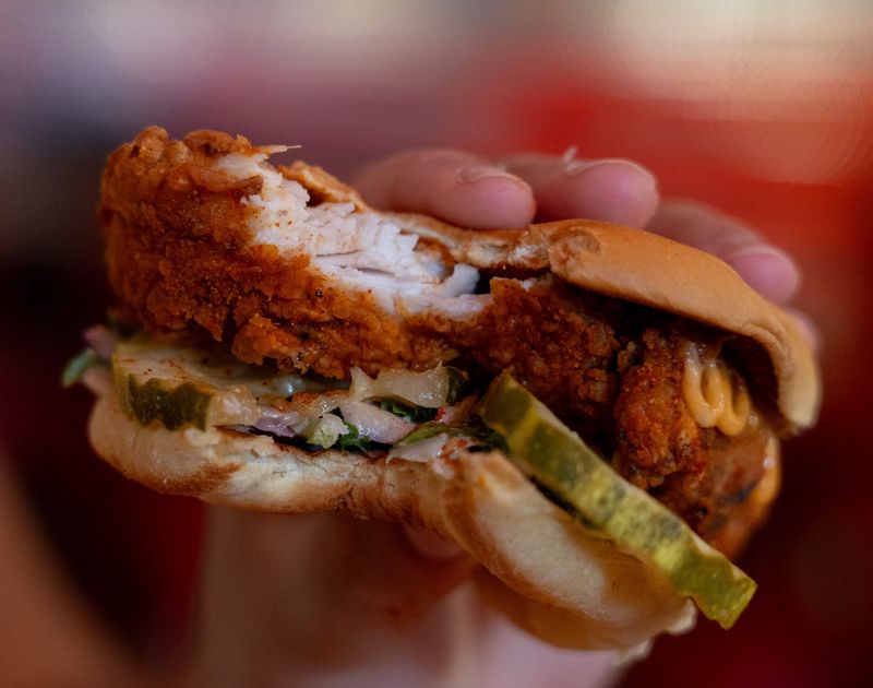 Dave’s Hot Chicken slider with pickles, slaw and Dave’s Sauce on April 15, 2026.