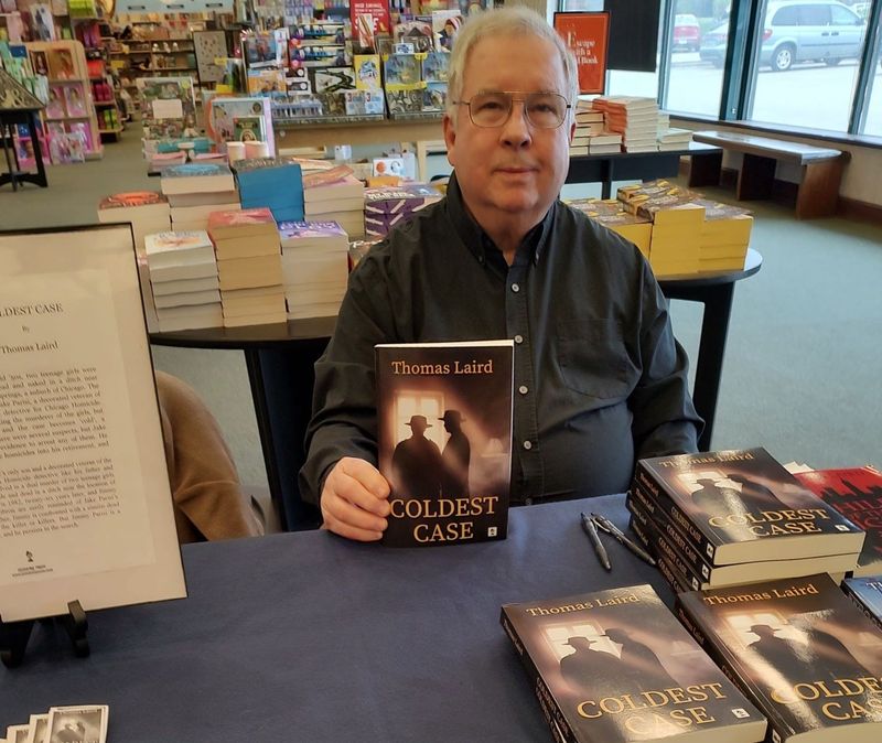 Local author Tom Laird signs copies of his latest novel "Coldest Case" at the Barnes and Noble bookstore in Peoria.