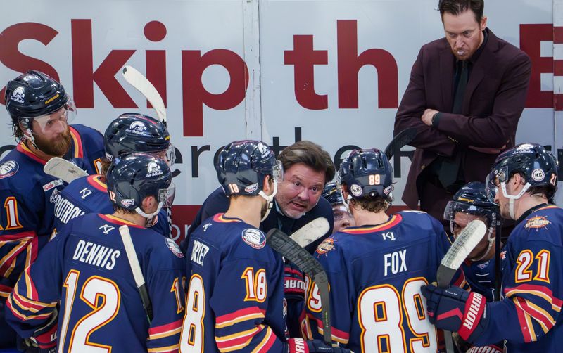 Peoria head coach Jean-Guy Trudel strategizes with his team as they fall behind the Knoxville Ice Bears in the third period of Game 2 of the SPHL semifinals Saturday, April 18, 2026 at the Peoria Civic Center.
