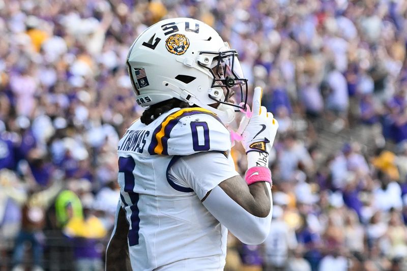 Oct 18, 2025; Nashville, Tennessee, USA; Louisiana State Tigers wide receiver Zavion Thomas (0) celebrates with his teammates after scoring a touchdown against the Vanderbilt Commodores during the second half at FirstBank Stadium. Mandatory Credit: Steve Roberts-Imagn Images