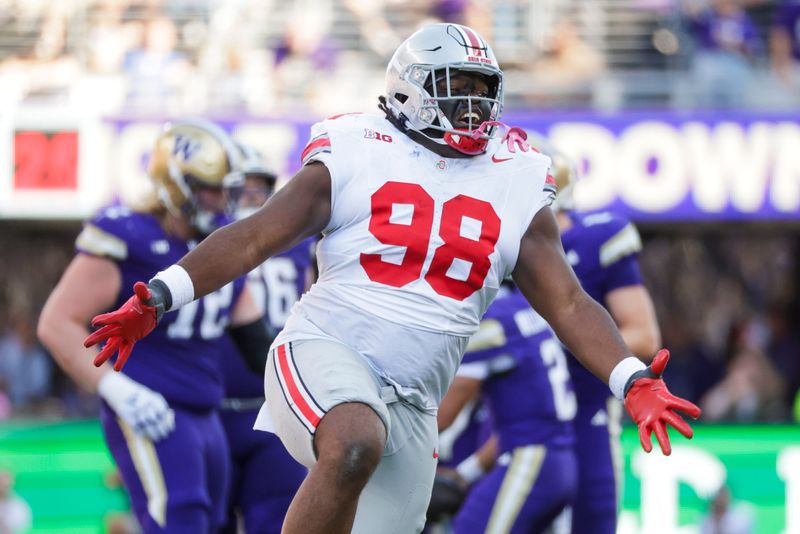 Sep 27, 2025; Seattle, Washington, USA; Ohio State Buckeyes defensive lineman Kayden McDonald (98) celebrates a sack against the Washington Huskies during the fourth quarter at Husky Stadium. Mandatory Credit: Joe Nicholson-Imagn Images