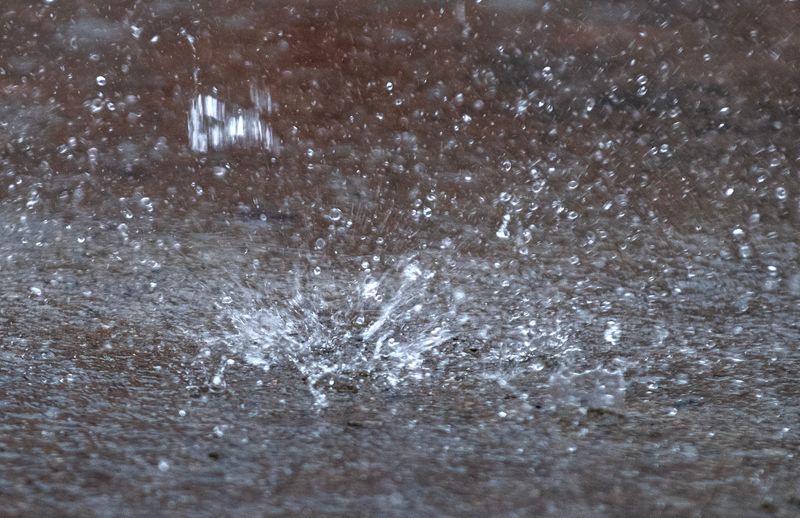 Large raindrops from a thunderstorm splash on the pavement at RTD’s Downtown Transit Center in downtown Stockton on Apr. 21, 2026.