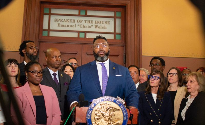 The House Democratic Caucus, led by Rep. Kam Buckner, gathers outside House Speaker Emanuel “Chris” Welch’s office on April 22, 2026. The chamber voted 78-32 to pass a megaprojects bill aimed at convincing the Chicago Bears to build a stadium in Arlington Heights.
