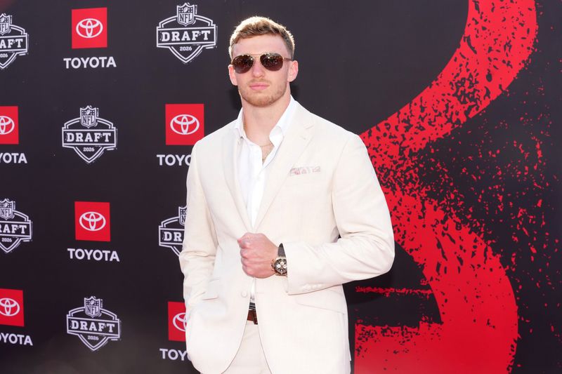 Apr 23, 2026; Pittsburgh, PA, USA; Oregon Ducks defensive back Dillon Thieneman poses on the red carpet before the 2026 NFL Draft at Point State Park. Mandatory Credit: Kirby Lee-Imagn Images