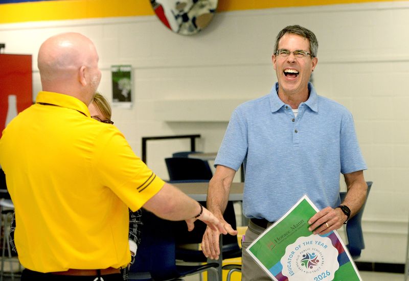 Southeast teacher Matt Maton, right, reacts as he is congratulated by Southeast Principal Cody Trigg after Maton found out he won the Horace Mann Educator of the year award Monday, April 27, 2026.