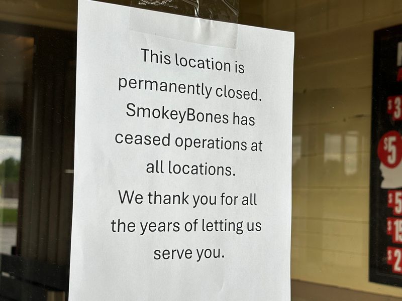 A sign on the door of Smokey Bones Bar & Fire Grill, 2660 S. Dirksen Pkwy., in Springfield.