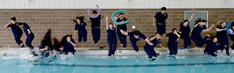 University of Illinois Chicago College of Nursing students jump into a pool at FitClub in Springfield on Thursday, April 30, 2026, as part of a decades-old tradition of celebrating graduation.