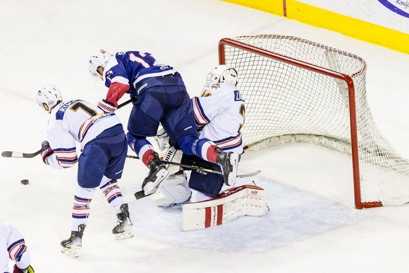 Peoria Rivermen goaltender Nick Latinovich knocked down in the second period by Evansville's Jordan Simoneau during Game 3 of the SPHL President's Cup Finals at Ford Center in Evansville, Ind., on May 6, 2026.
