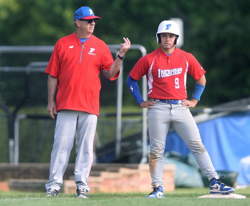 Pawnee coach Chris Hennemann coaches third base during the game Thursday, May 7, 2026.