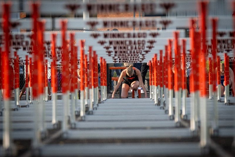 Winnebago hurdler Avery Brule looks down the track just before a 100-meter hurdling race at the Big Northern Conference meet on May 7, 2026, in Winnebago.