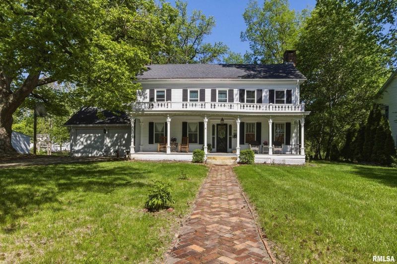 This Federal-style home built in 1920 in Macomb is on the market for $182,500.