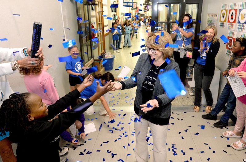 School District 186 Superintendent Jennifer Gill is showered with praise and confetti during her visit to Butler Elementary School May 15, 2026, as part of her district-wide tour of schools prior to her retirement. Gill has served as superintendent since 2014.