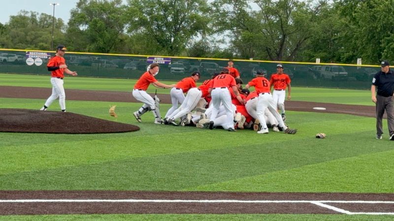 The Harlem Huskies celebrate after pulling out a 7-0 win over Hononegah to take the late-season lead in the NIC-10 on May 18, 2026, in Rockton.