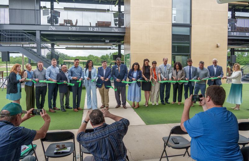 Gov. JB Pritzker and other state and local officials snip the ribbon on the official opening of the Golf Learning Center at 7815 N. Radnor Road in Peoria. The $6.5 million project was funded in part by $4.75 million in grants from the Illinois Department of Commerce and Economic Opportunity, with the remainder covered by the Peoria Park District.