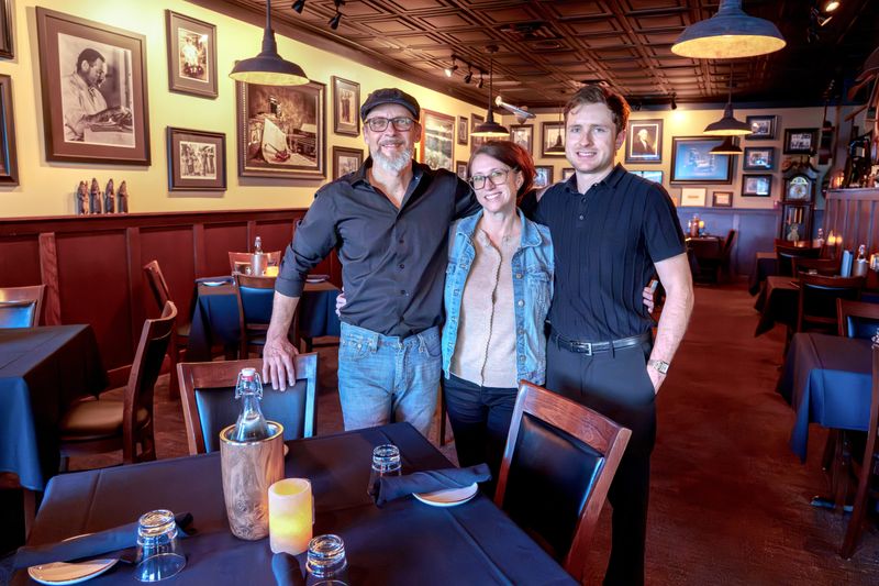 Todd Hohulin, left, and his wife Cyndi have been running 2 Chez Restaurant at 7815 Knoxville Avenue in Peoria since their son Isaac was a child. Isaac now works as a bartender at the family business that recently hit its 20th anniversary.