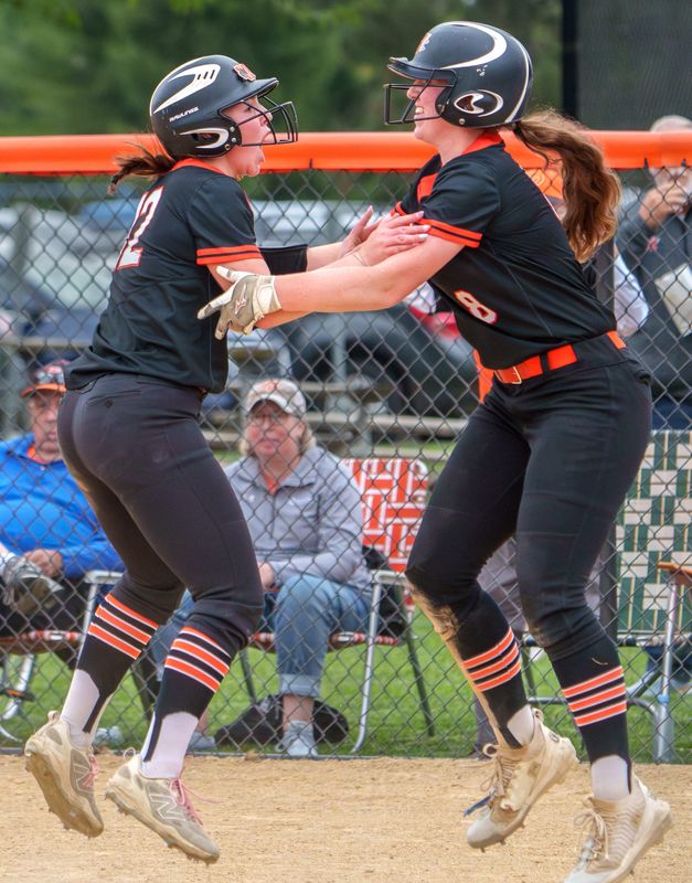 Washington’s Lyvia Williams, left, and Sophie Walker jumps for joy after taking the lead against Normal West in the sixth inning of the Class 3A girls softball regional title game Friday, May 22, 2026 in Washington. The Panthers defeated the Wildcats 3-1 to advance to the Lincoln Sectional.