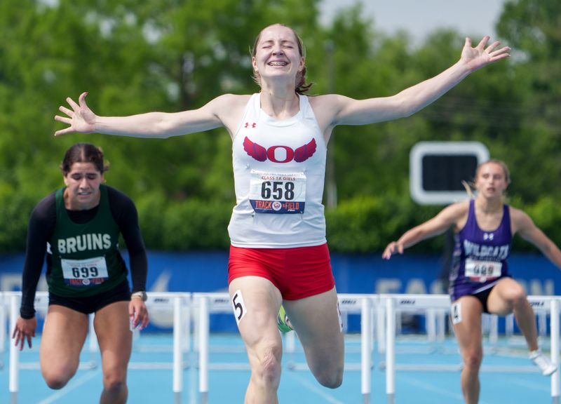Oregon's Jillian Hammer reacts at the finish line after winning the Class 1A 300-meter hurdles Saturday, May 23, 2026 at the IHSA State Track and Field Championships at Eastern Illinois University in Charleston.