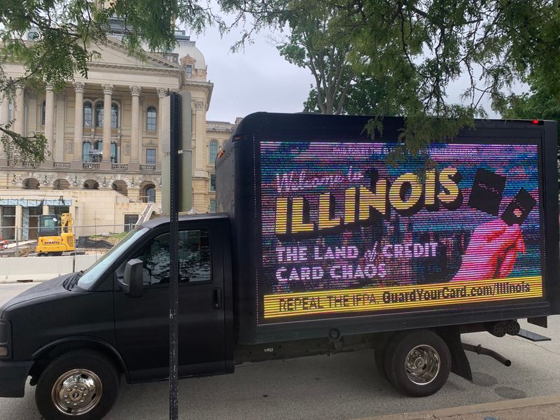 A screen truck petitions Illinois lawmakers to repeal the Interchange Fee Prohibition Act on May 23, 2026.