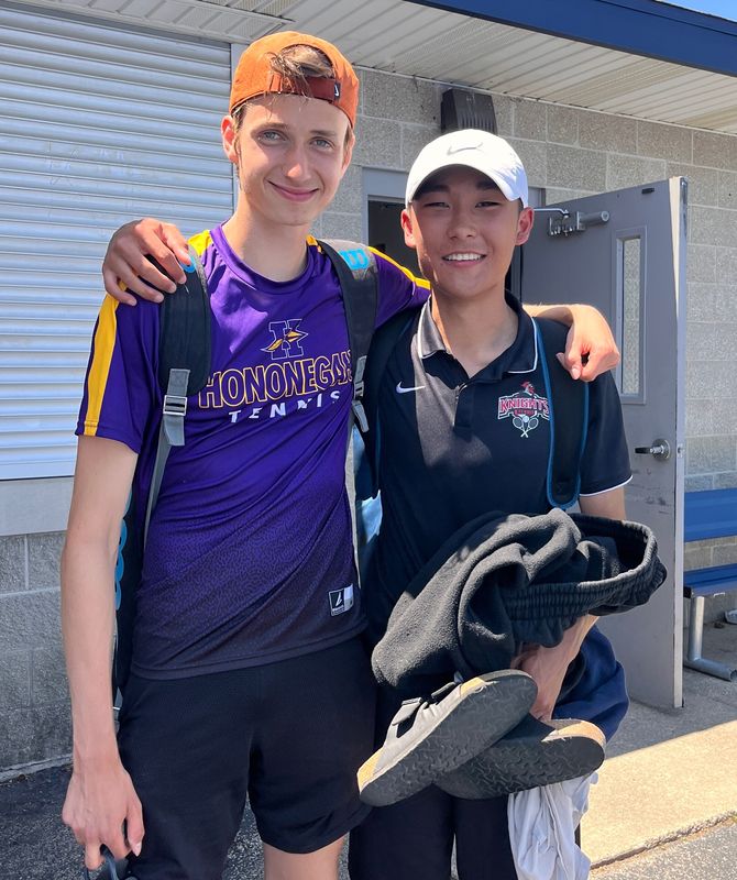 Hononegah's Braden Monson (left) and Auburn's Austin Altangerel pose for a photo while competing at the IHSA boys state tennis tournament from May 28-30 in Palatine.