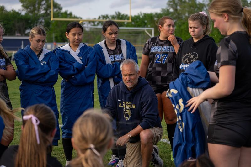 The Rockford Christian Royal Lions head coach Eron Harvey talks to his squad during a run to the regional title in the 2026 season.