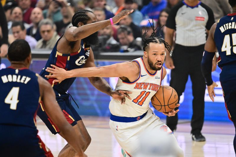 New York Knicks guard Jalen Brunson (11) drives the ball past Cleveland Cavaliers guard James Harden (1) in the first quarter during Game 4 of the Eastern Conference Finals for the 2026 NBA playoffs at Rocket Arena on May 25, 2026.