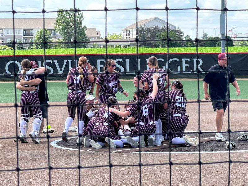 Dakota softball players celebrate their 2-1 comeback victory in the IHSA Class 1A state championship game on Saturday, June 6, 2026, in Peoria, Illinois. Dakota defeated Waltonville-Sesser-Valier for the title.