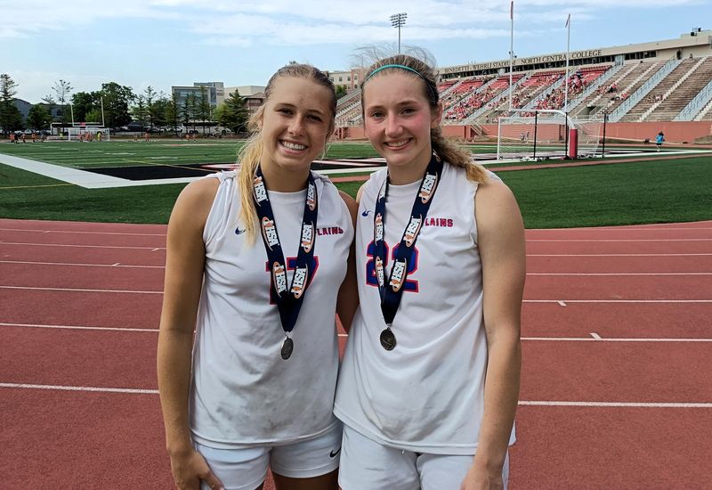 Pleasant Plains seniors Bailey Leach, left, and Grace Sabatka received their Class 1A state runner-up medals after a 3-0 loss to Glen Carbon Father McGivney at North Central College in Naperville on Saturday, June 6.