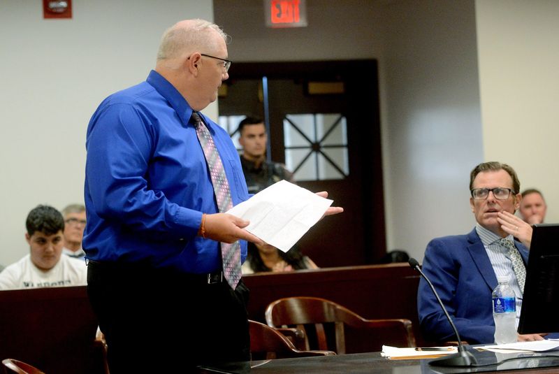 Peter Cadigan turns toward Earl Moore's family and apologizes during his sentencing hearing at the County Building Tuesday, June 23, 2026.
