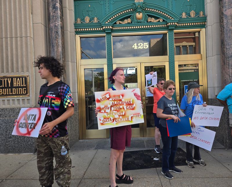 Residents hold signs and march against a potential data center Monday, June 29, 2026, outside Rockford City Hall, 425 E. State St.