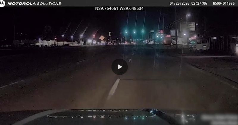 A screenshot from dashcam footage of a fatal crash involving an Illinois State Police Trooper fatally hitting a pedestrian in Springfield in April 2026.