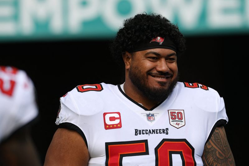 Dec 28, 2025; Miami Gardens, Florida, USA; Tampa Bay Buccaneers defensive tackle Vita Vea (50) walks out for player introductions prior to a game against the Miami Dolphins at Hard Rock Stadium. Mandatory Credit: Nathan Ray Seebeck-Imagn Images