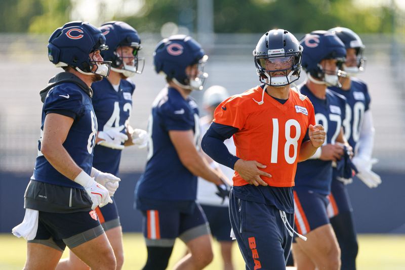 Jul 29, 2026; Lake Forest, IL, USA; Chicago Bears quarterback Caleb Williams (18) runs on the field during Training Camp at Halas Hall. Mandatory Credit: Kamil Krzaczynski-Imagn Images