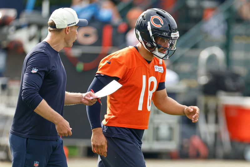 Jul 31, 2026; Lake Forest, IL, USA; Chicago Bears head coach Ben Johnson talks to quarterback Caleb Williams (18) during Training Camp at Halas Hall. Mandatory Credit: Kamil Krzaczynski-Imagn Images
