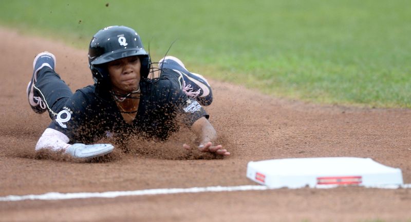 Los Angeles Queens Mo'ne David slides into third base during the game against the New York Heights at the season opener of the Women's Professional Baseball League at Roberts Stadium Saturday, August 1, 2026.