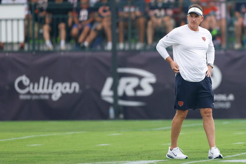 Aug 5, 2026; Lake Forest, IL, USA; Chicago Bears defensive coordinator Dennis Allen walks on the field during training camp at Halas Hall. Mandatory Credit: Kamil Krzaczynski-Imagn Images