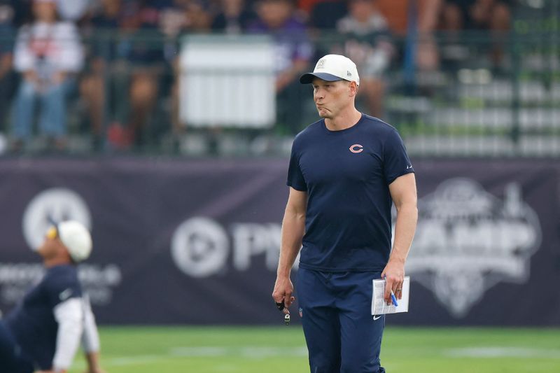 Aug 5, 2026; Lake Forest, IL, USA; Chicago Bears head coach Ben Johnson walks on the field during training camp at Halas Hall. Mandatory Credit: Kamil Krzaczynski-Imagn Images