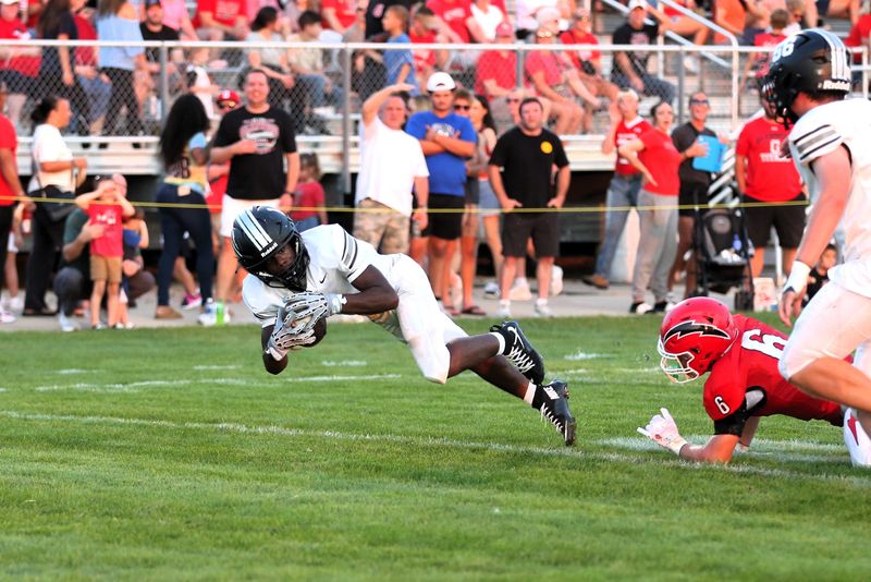 Normal West's K'Shaun Jones lunges for a touchdown against Chatham Glenwood during the first quarter of nonconference football game at the Glenwood Athletic Complex on Friday, Aug. 21, 2026.