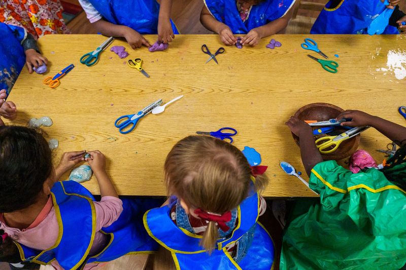 Students inside Pamela Brim's pre-K classroom play with slime Friday, Dec. 2, 2022, at St. Mary's Early Childhood Center in Indianapolis.