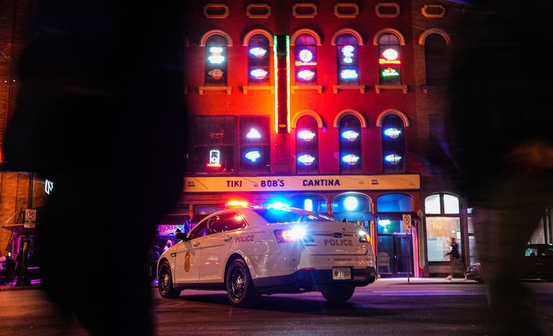 Officers block the street outside of a busy bar district Saturday, Jan. 14, 2023 on South Meridian Street in downtown Indianapolis.