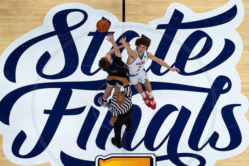 Fort Wayne Blackhawk Christian Brave Kellen Pickett (4) and Linton-Stockton Miner Braden Walters (2) tip off at the start of IHSAA Class 2A state finals game Saturday, March 25, 2023, at Gainbridge Fieldhouse in Indianapolis.