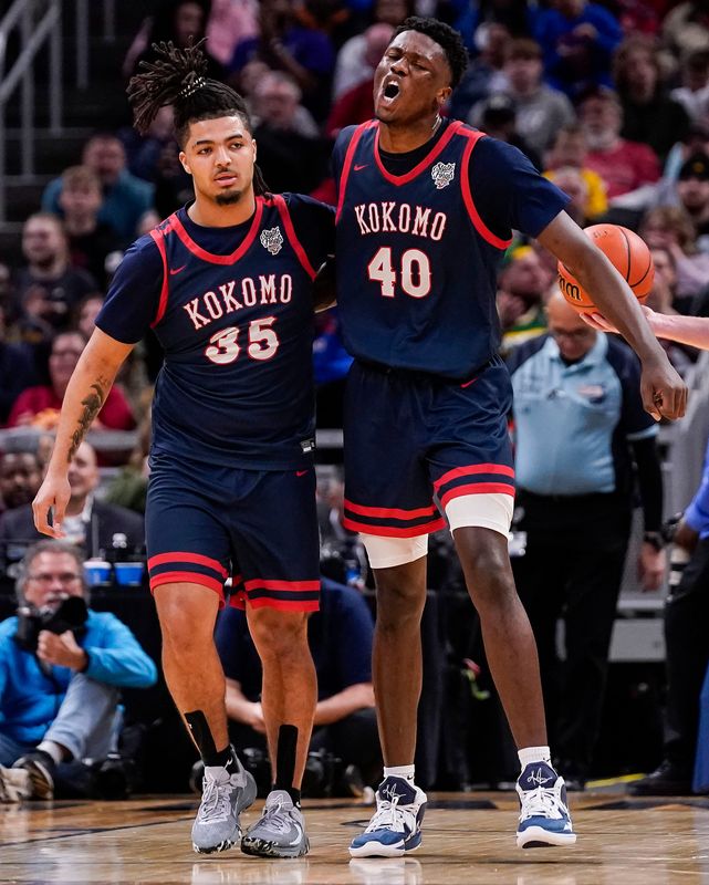 Kokomo Wildkats center Flory Bidunga (40) yells in excitement with Kokomo Wildkats guard Shayne Spear (35) on Saturday, March 25, 2023 at Gainbridge Fieldhouse in Indianapolis. The Ben Davis Giants defeated the Kokomo Wildkats, 53-41, for the IHSAA Class 4A state finals championship.