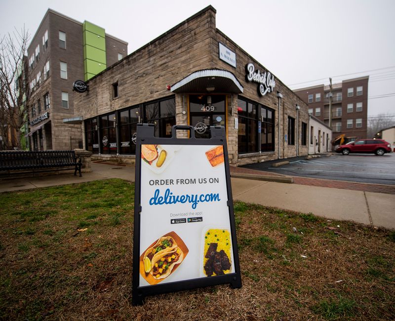 The delivery sign outside Bedrak Cafe, as seen on Thursday, March 19, 2020. (Rich Janzaruk / Herald-Times)