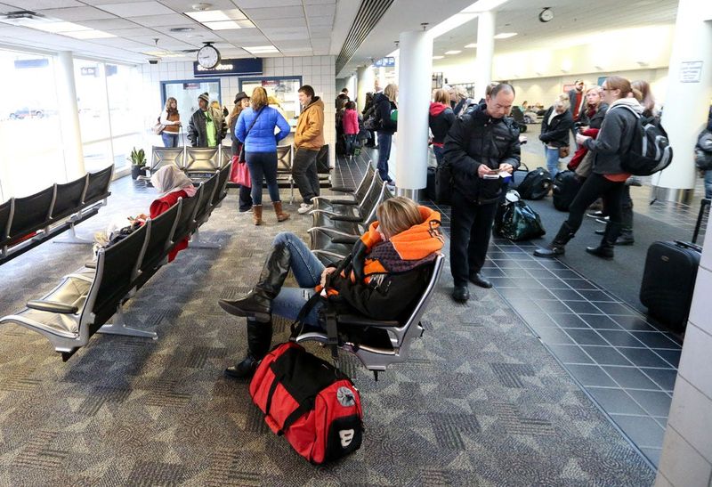 Passengers wait inside the terminal before boarding a westbound South Shore train Saturday at the South Bend Regional Airport.