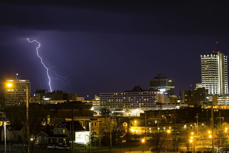 Lightning strikes southwest of downtown South Bend Wednesday, May 2, 2018, as scattered thunderstorms rolled through the area.